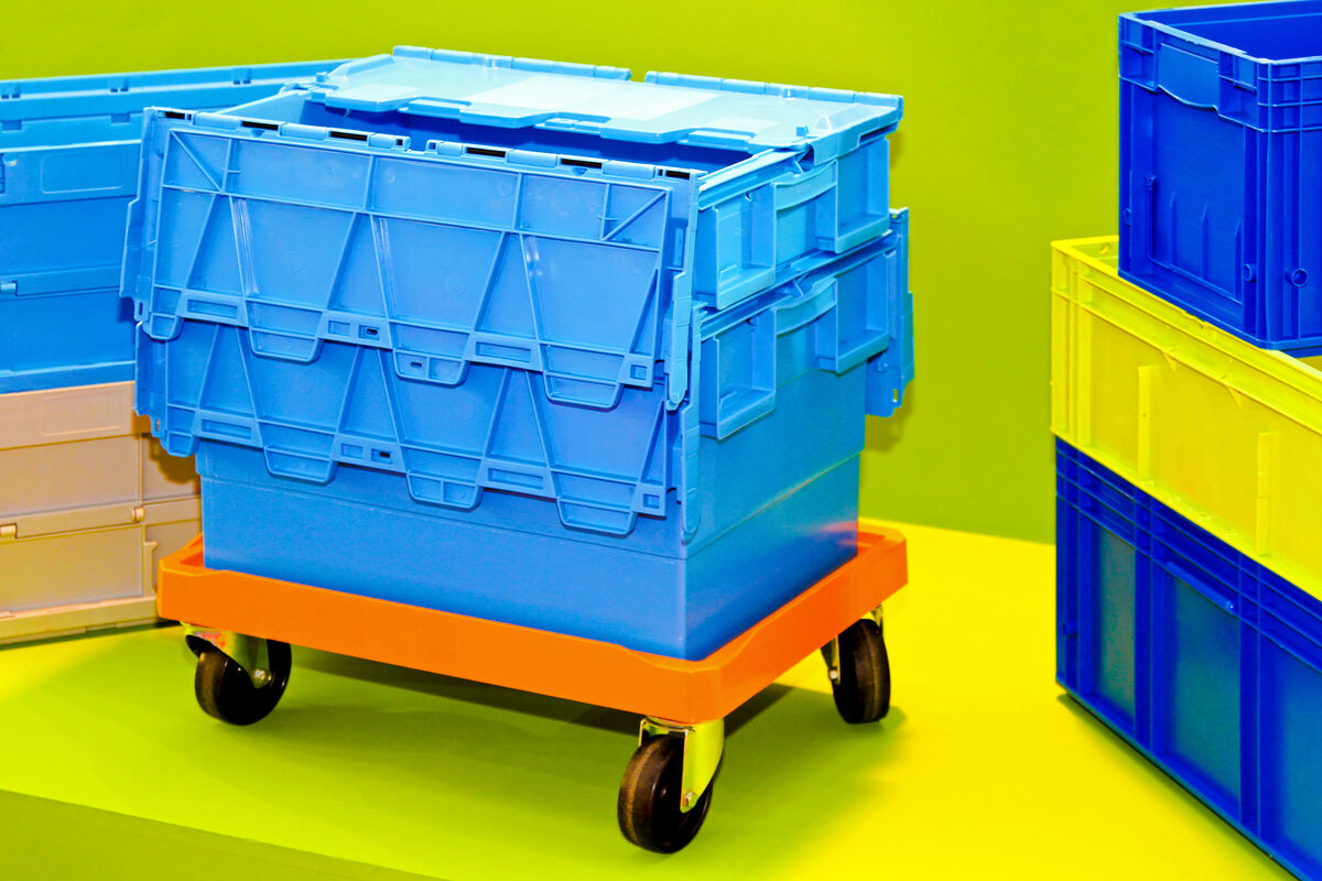 Moving totes stacked on a dolly, ready for delivery